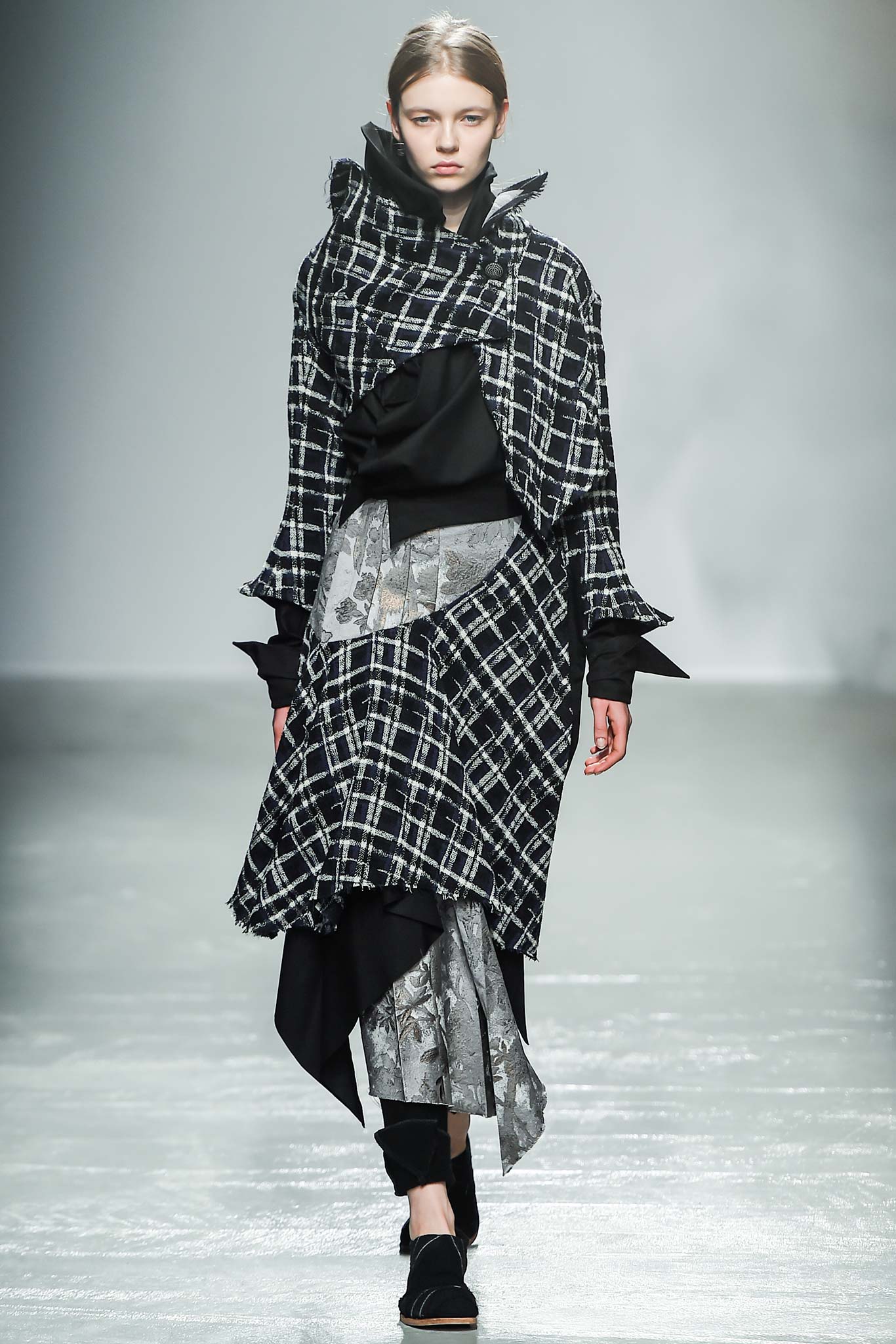 black and white layered coat with pleated skirt