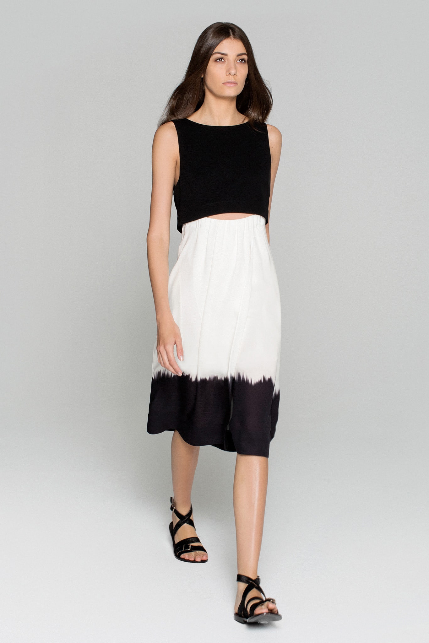 black fitted top with pleated skirt