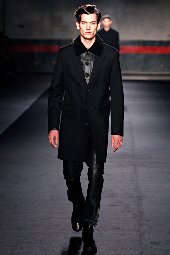 black tailored coat and leather pants