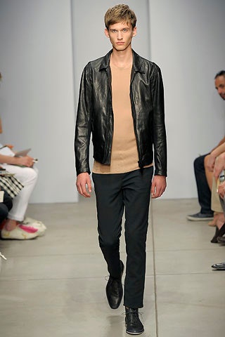 black leather fitted jacket with beige shirt