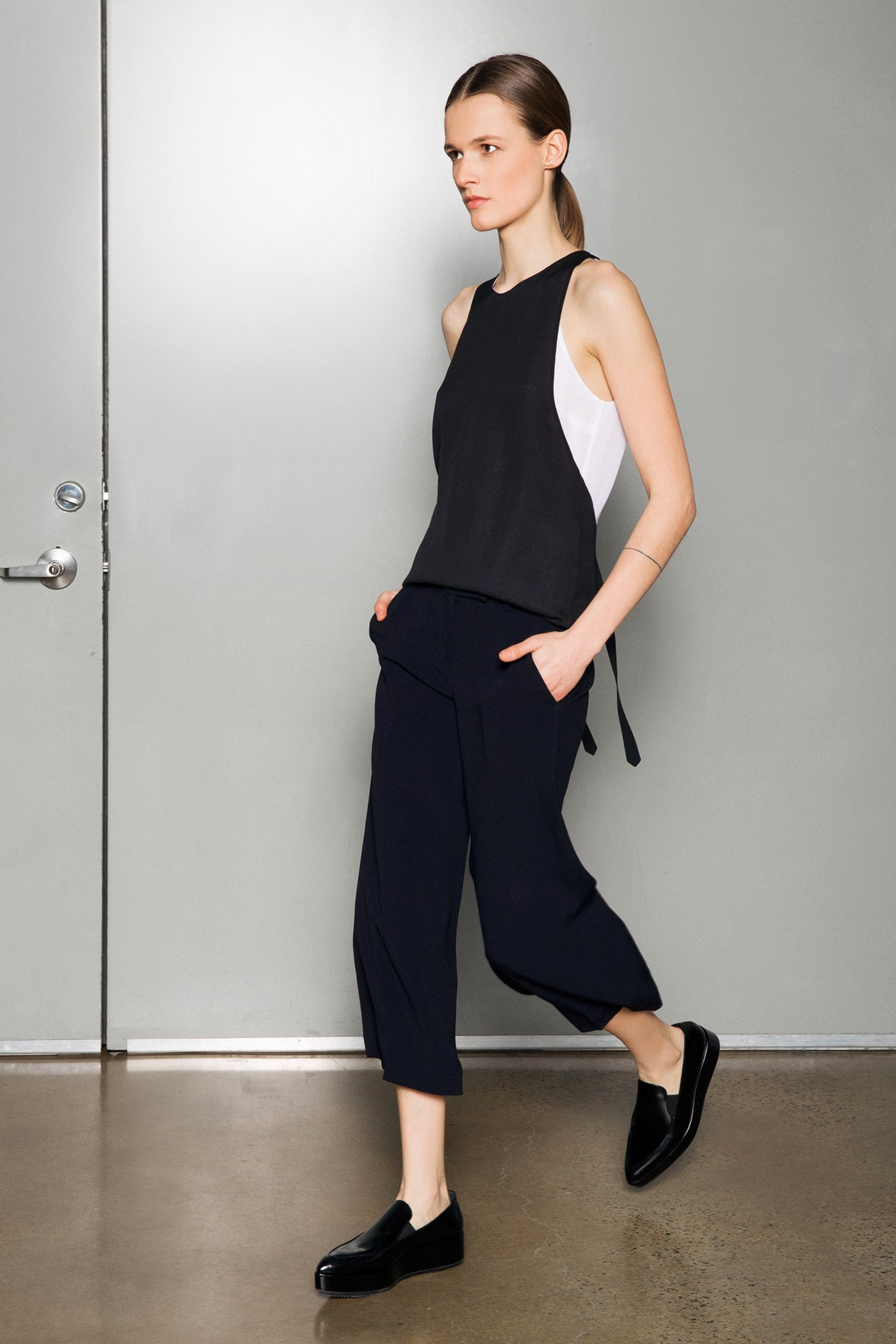 black cotton sleeveless high-neck fitted top