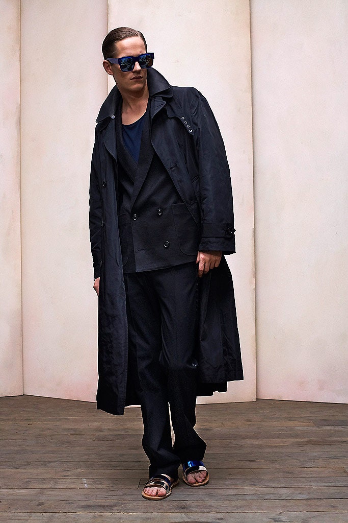 black trench coat and suit