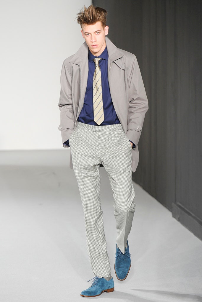 gray coat blue shirt striped pants