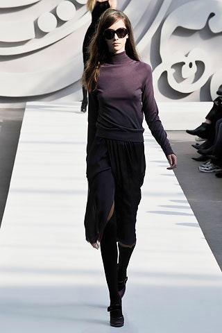 purple fitted top with black skirt