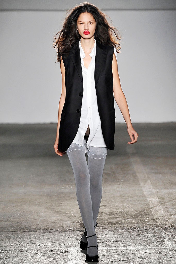 black vest white shirt gray leggings