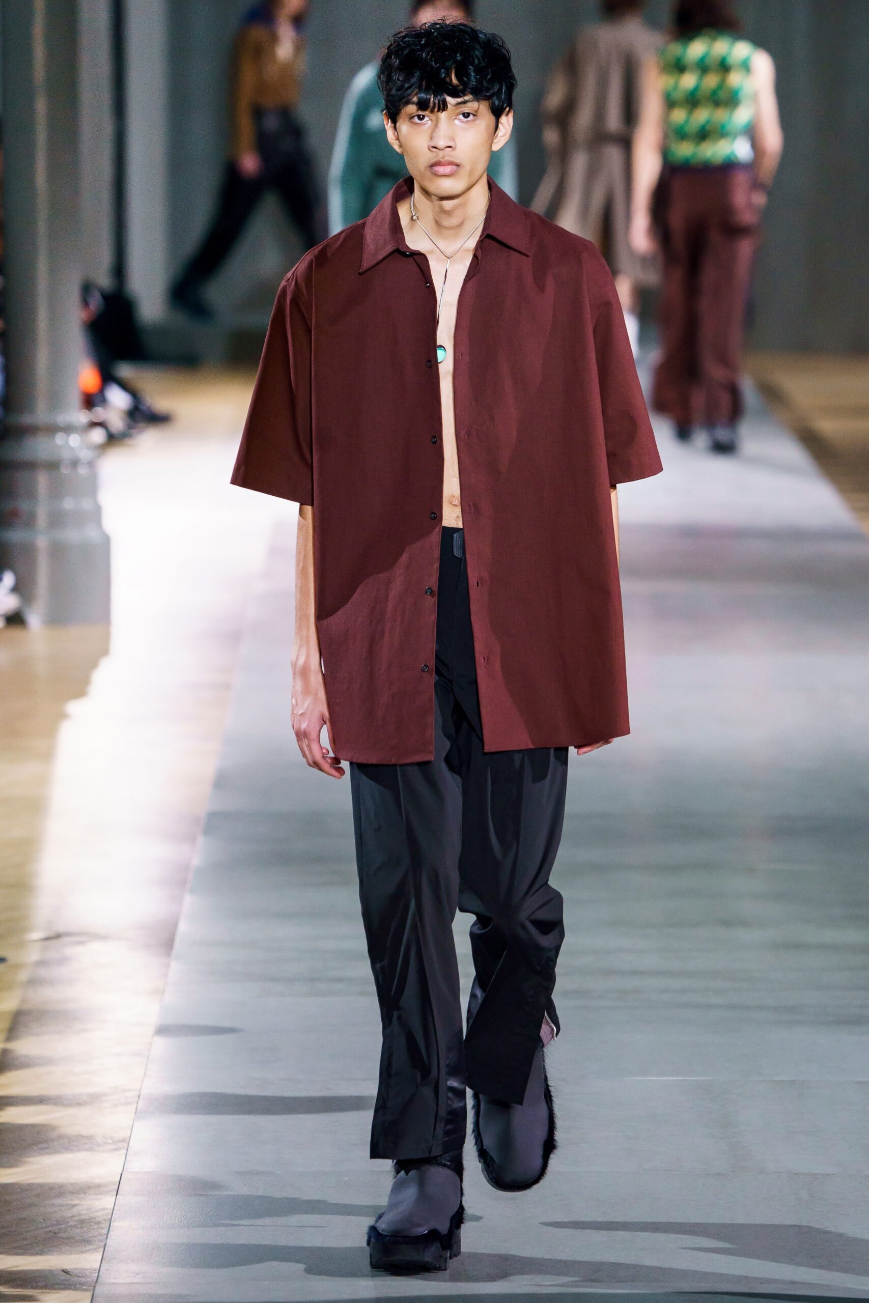 brown relaxed shirt with black pants