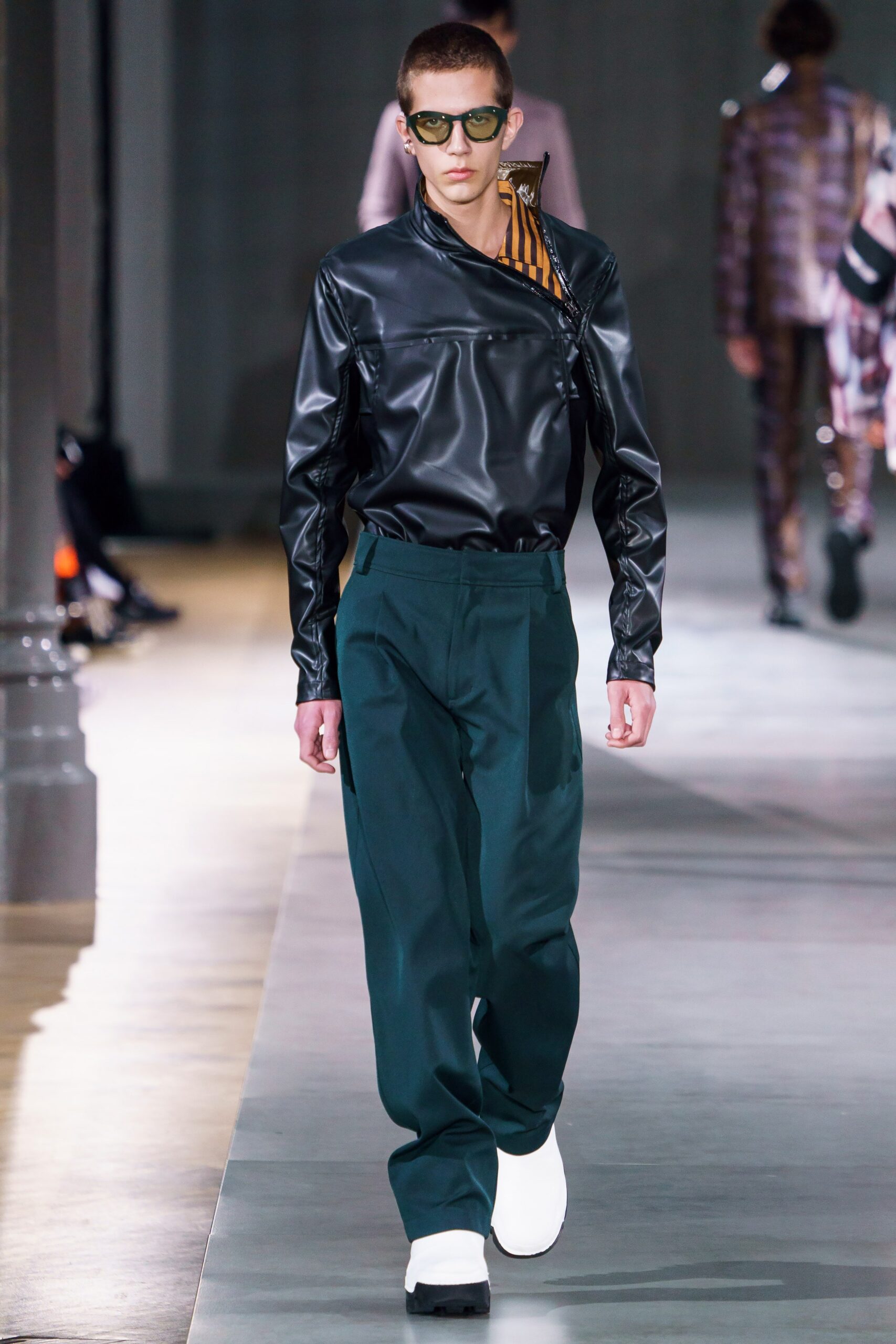 black leather fitted shirt with green pants