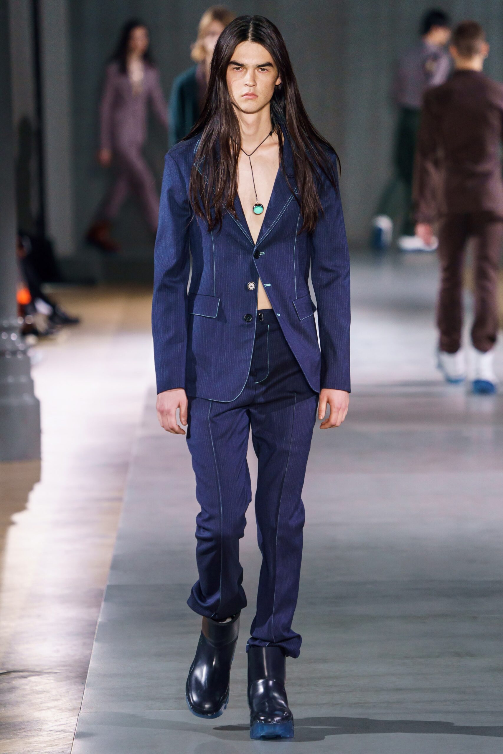 blue tailored suit with black shoes
