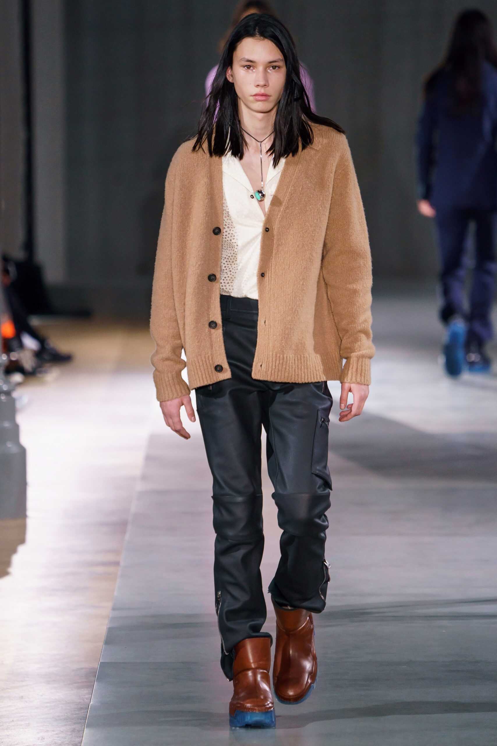 beige wool cardigan with black leather pants