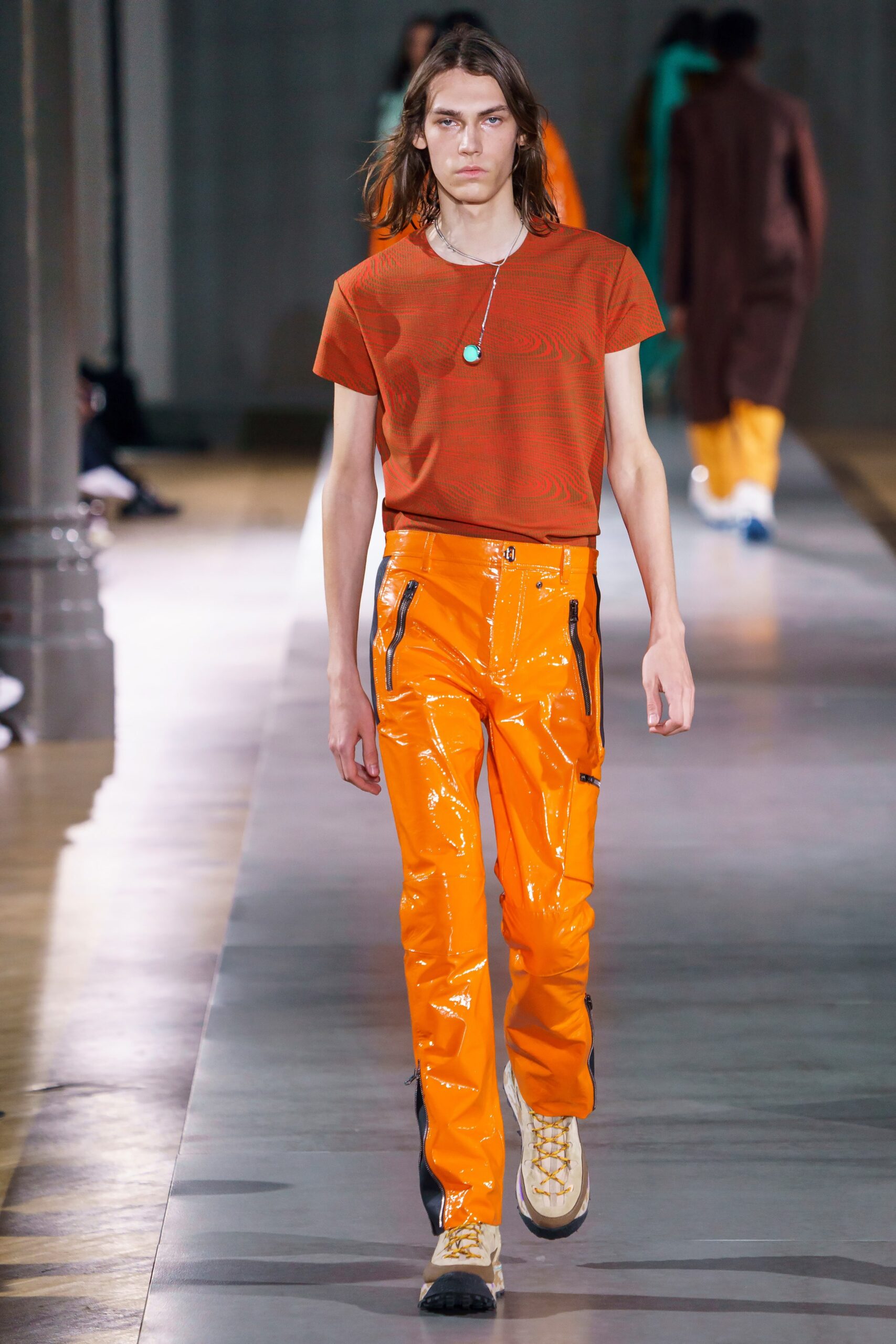 red t-shirt and orange vinyl pants
