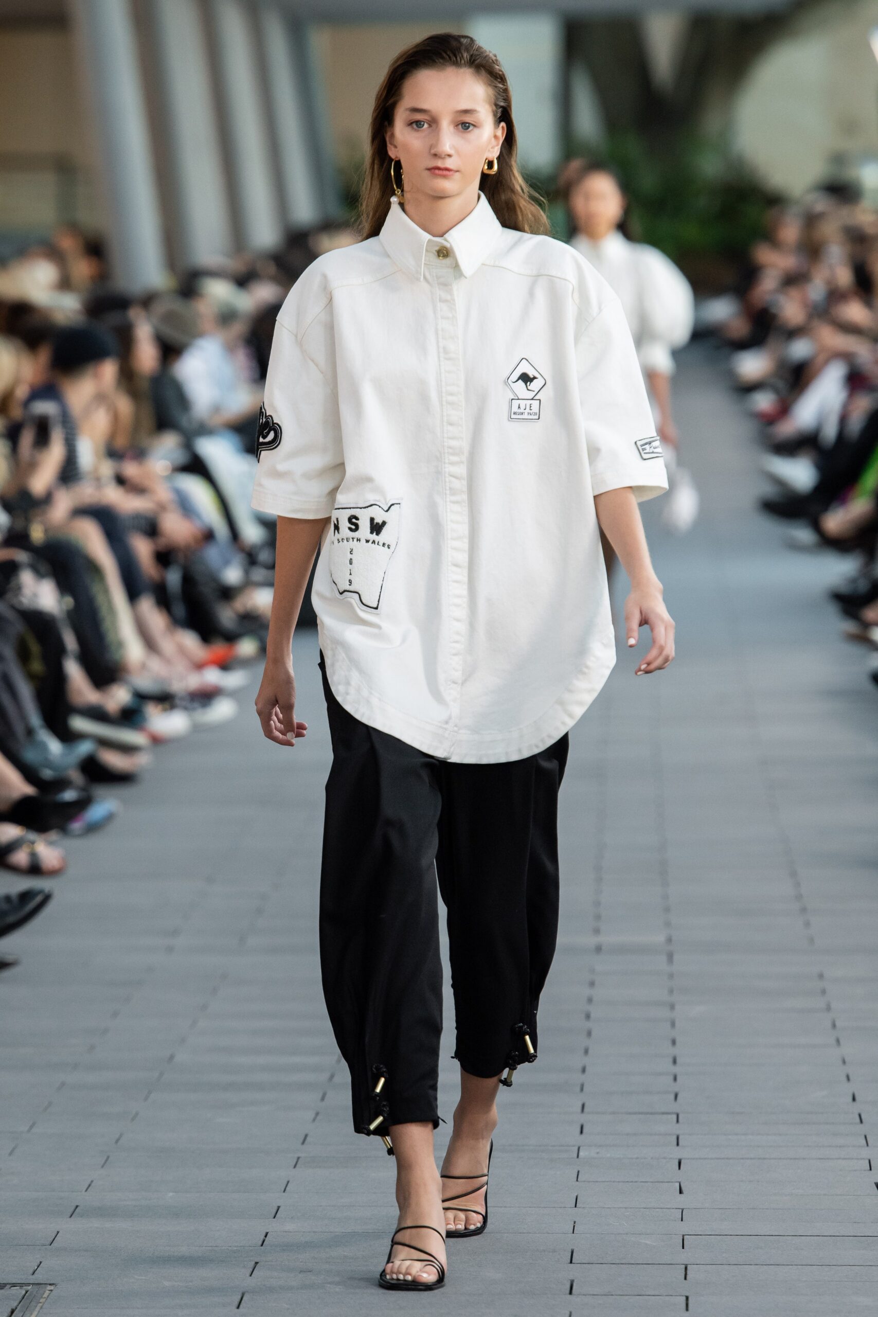 oversized white shirt with relaxed black pants