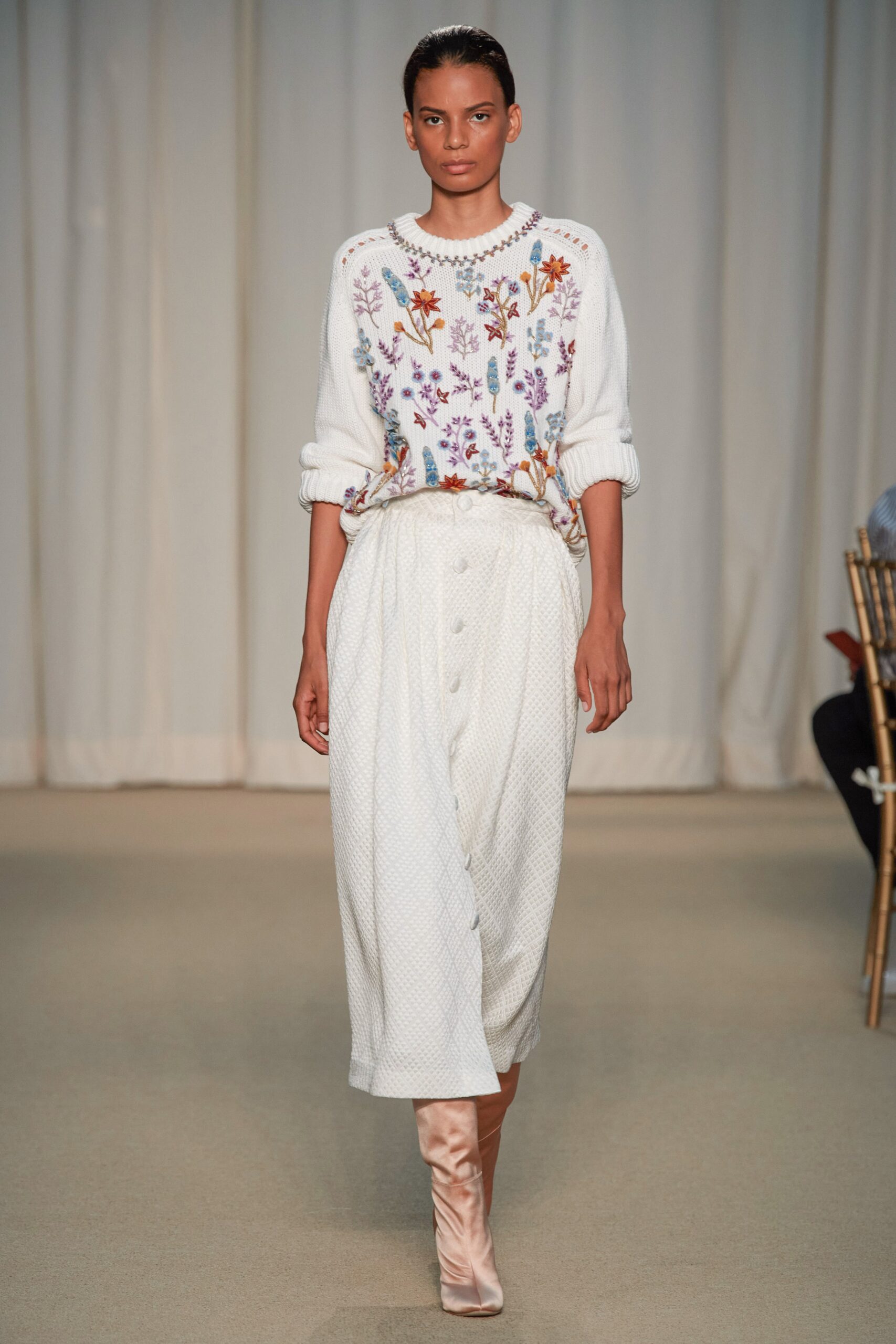 white embroidered sweater and midi skirt