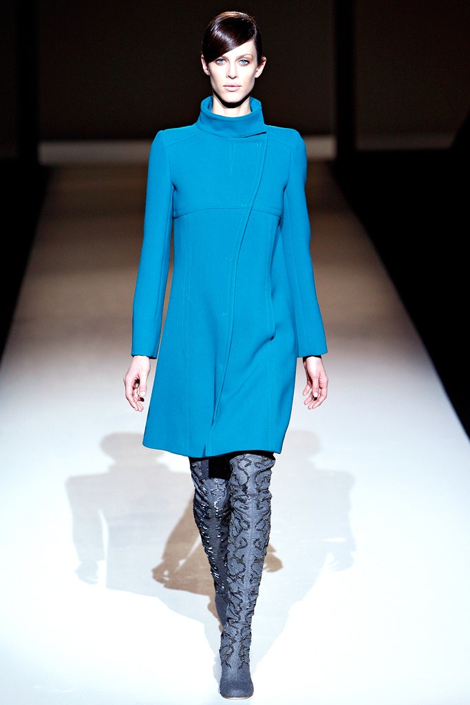 blue fitted coat with gray boots