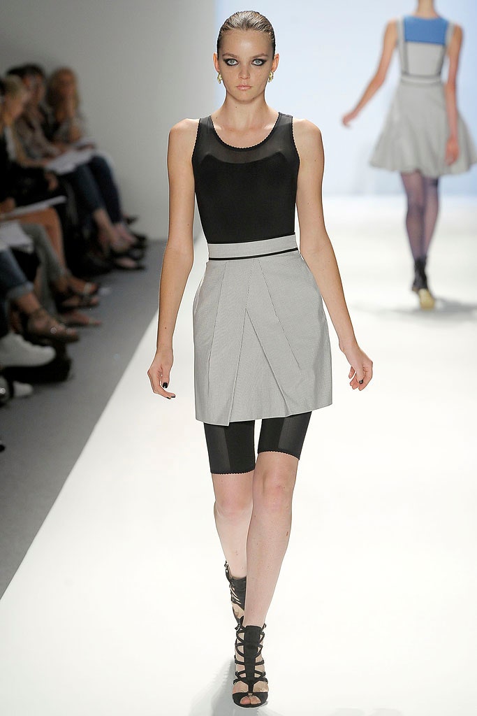 black fitted top gray pleated skirt