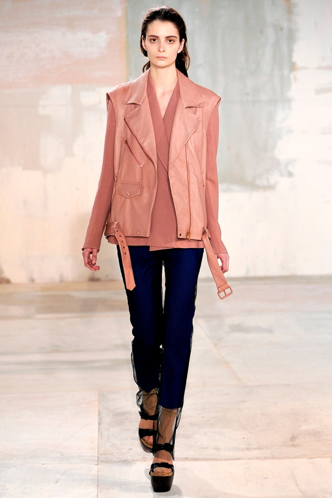 pink leather fitted jacket with blue pants