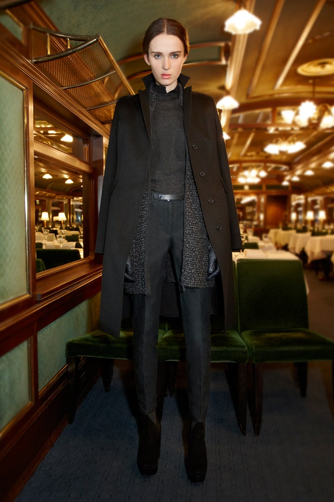 black fitted coat and tailored pants