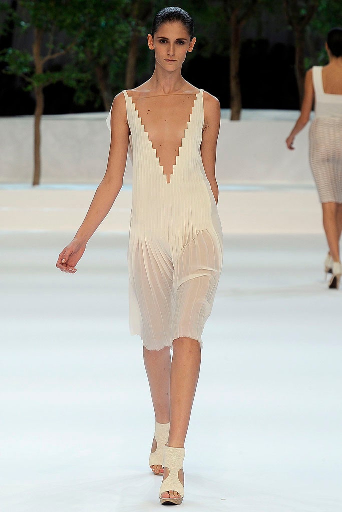 white silk sleeveless pleated dress