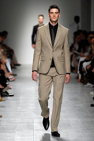 beige tailored suit with black shirt