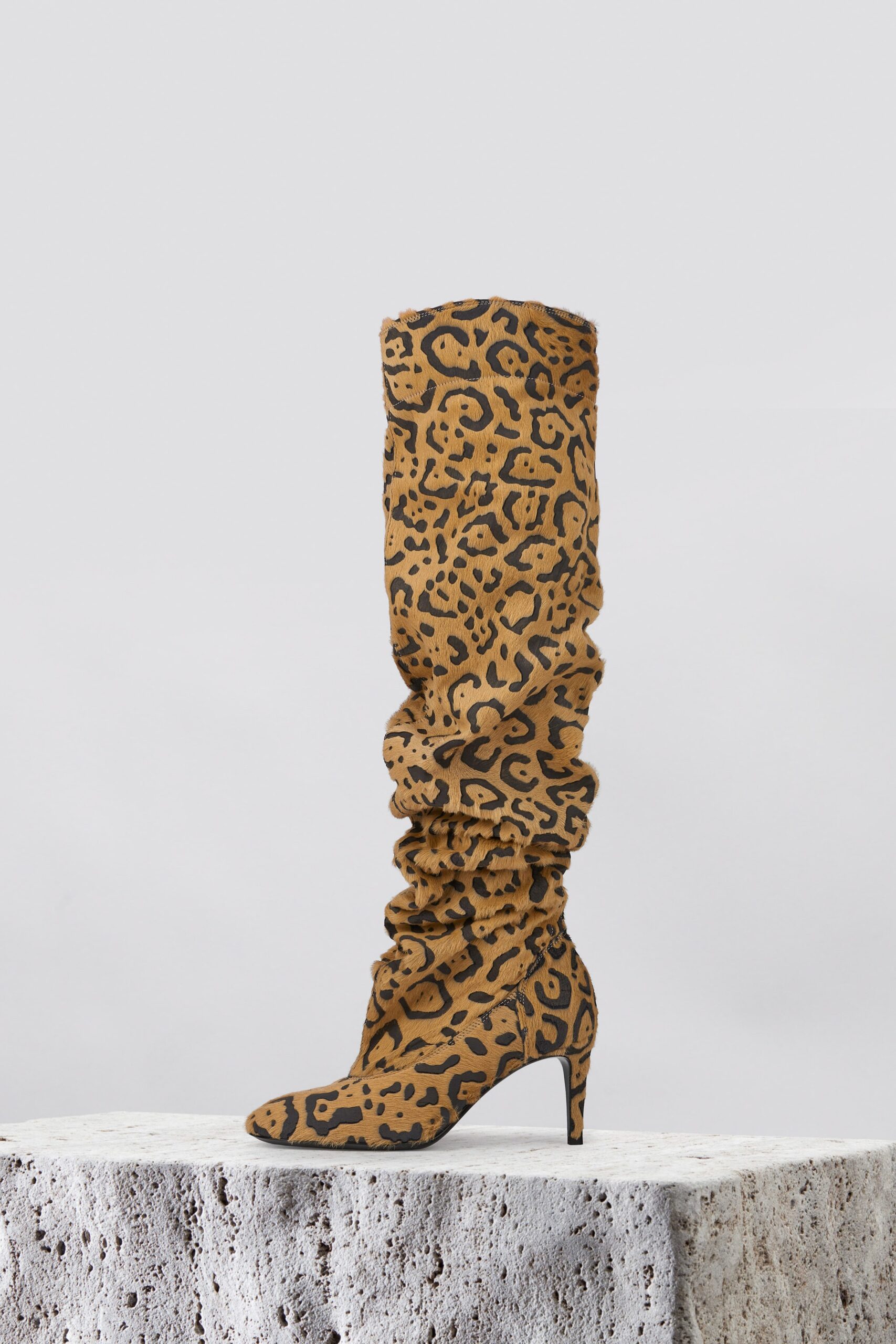 brown and black animal-print boots