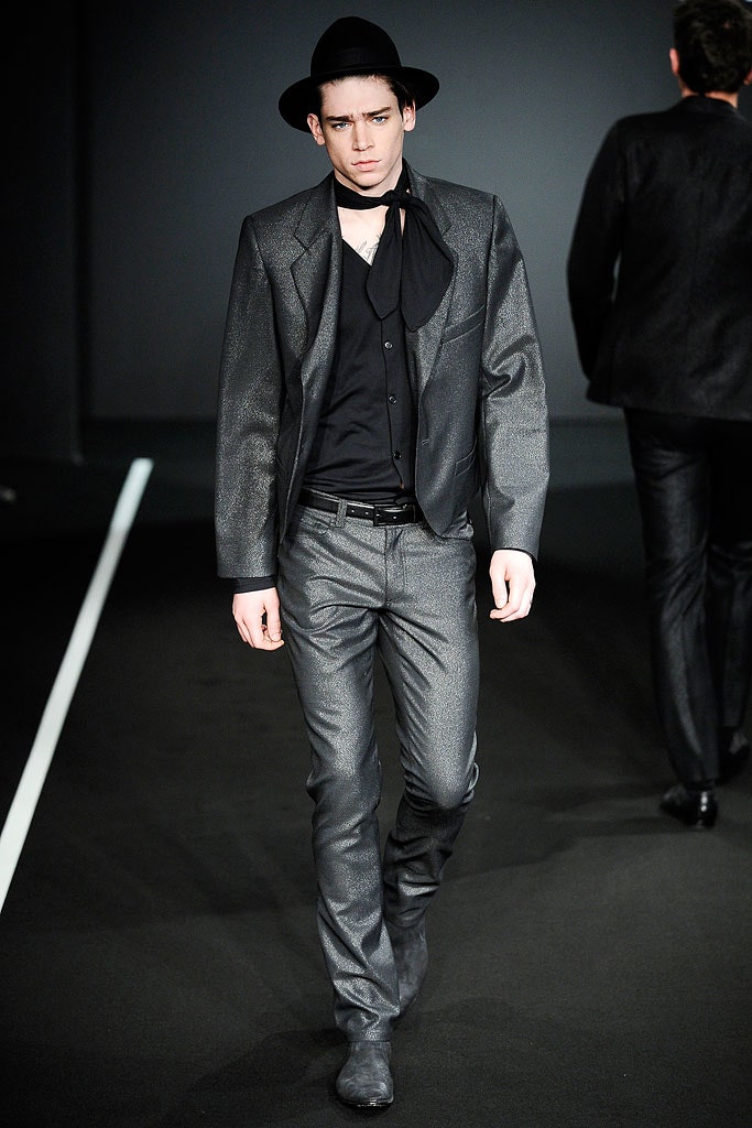 gray tailored suit with black hat