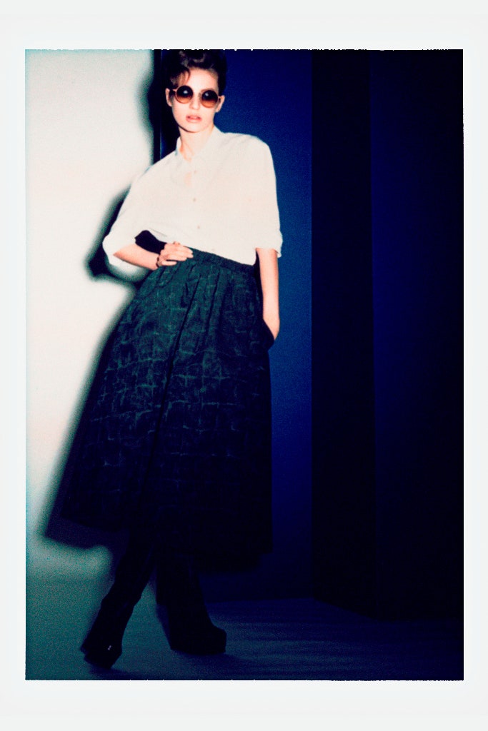 white shirt black pleated skirt