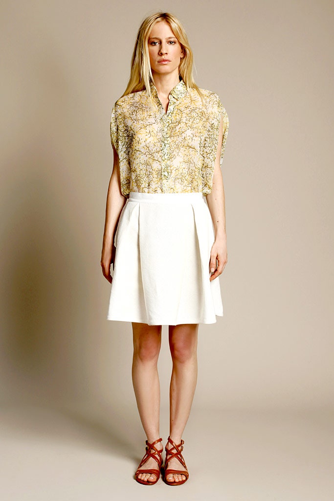 yellow printed blouse white pleated skirt