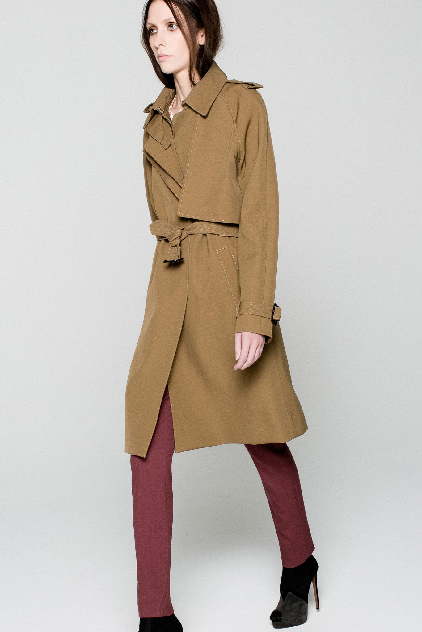 brown trench coat with red pants