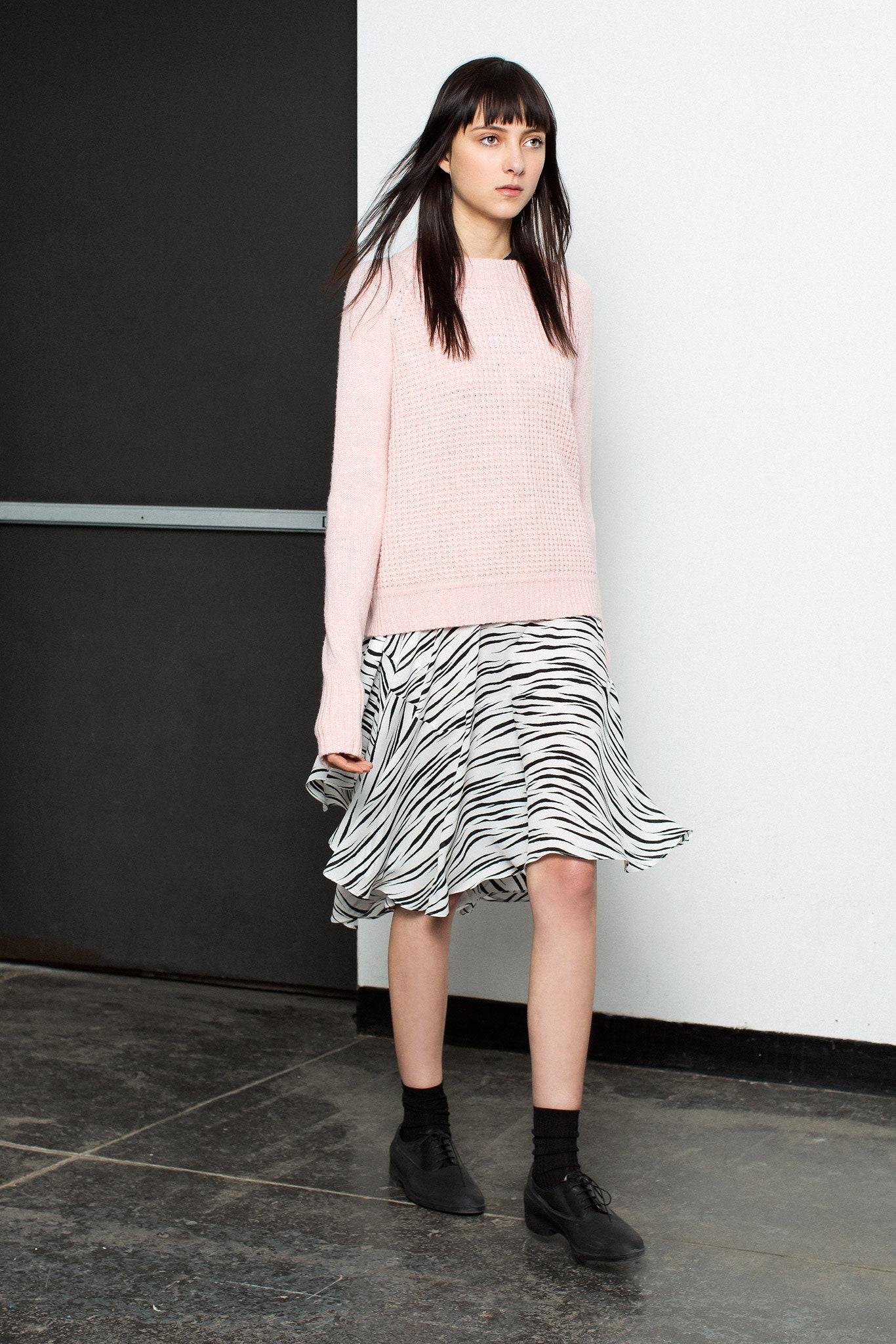 pink relaxed sweater with flared skirt