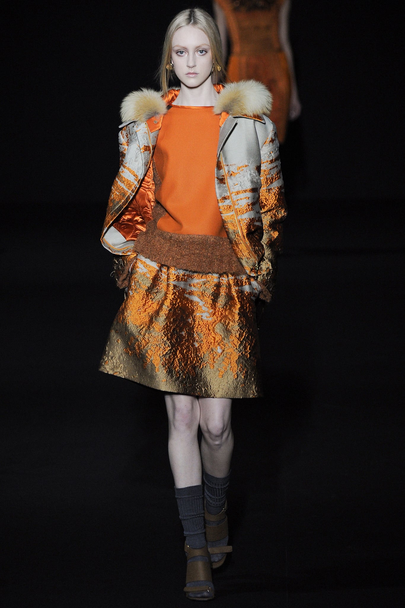 orange silk fitted jacket and skirt