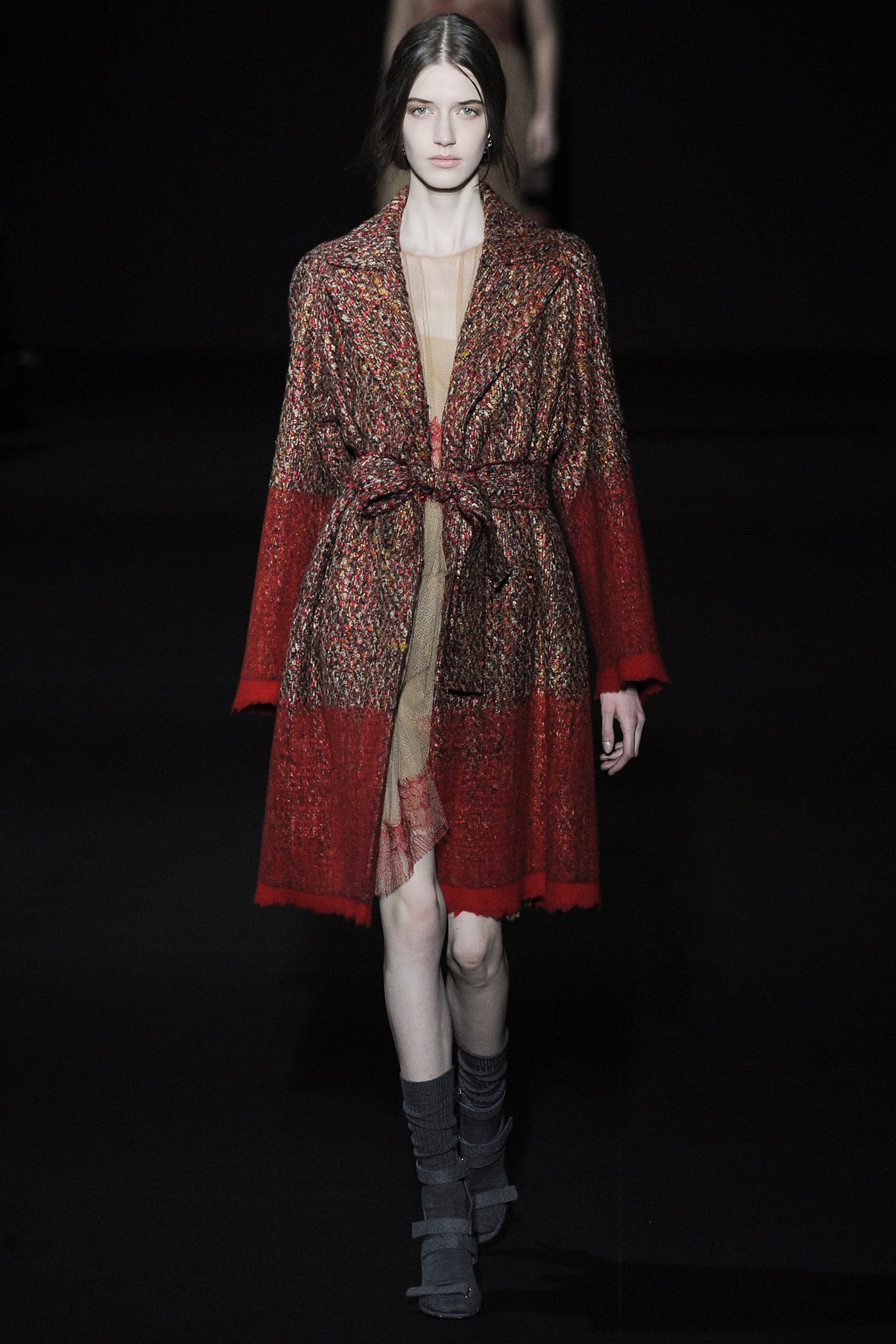 red and gold belted coat with beige dress