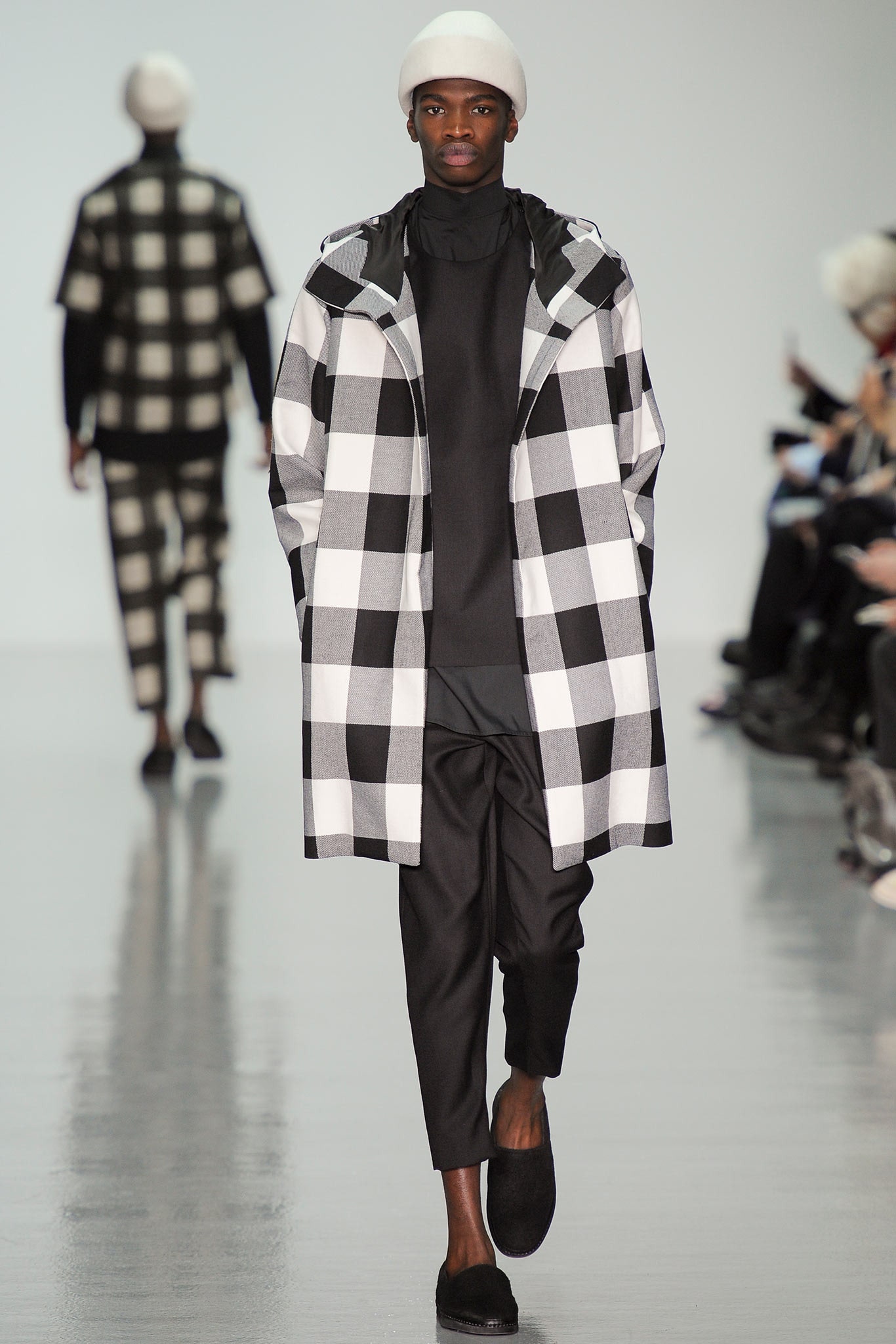 checked black and white coat