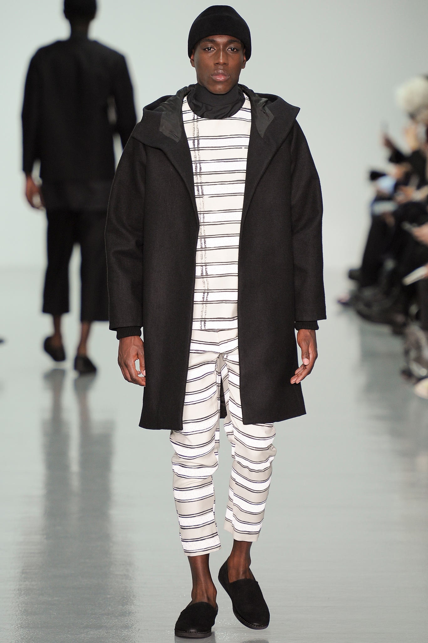 black coat with striped jumpsuit