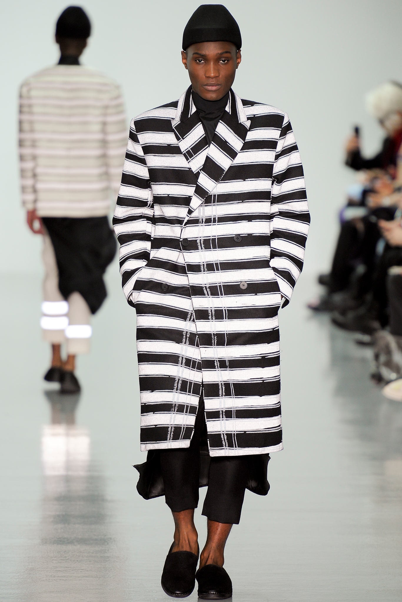 striped black and white coat with relaxed pants