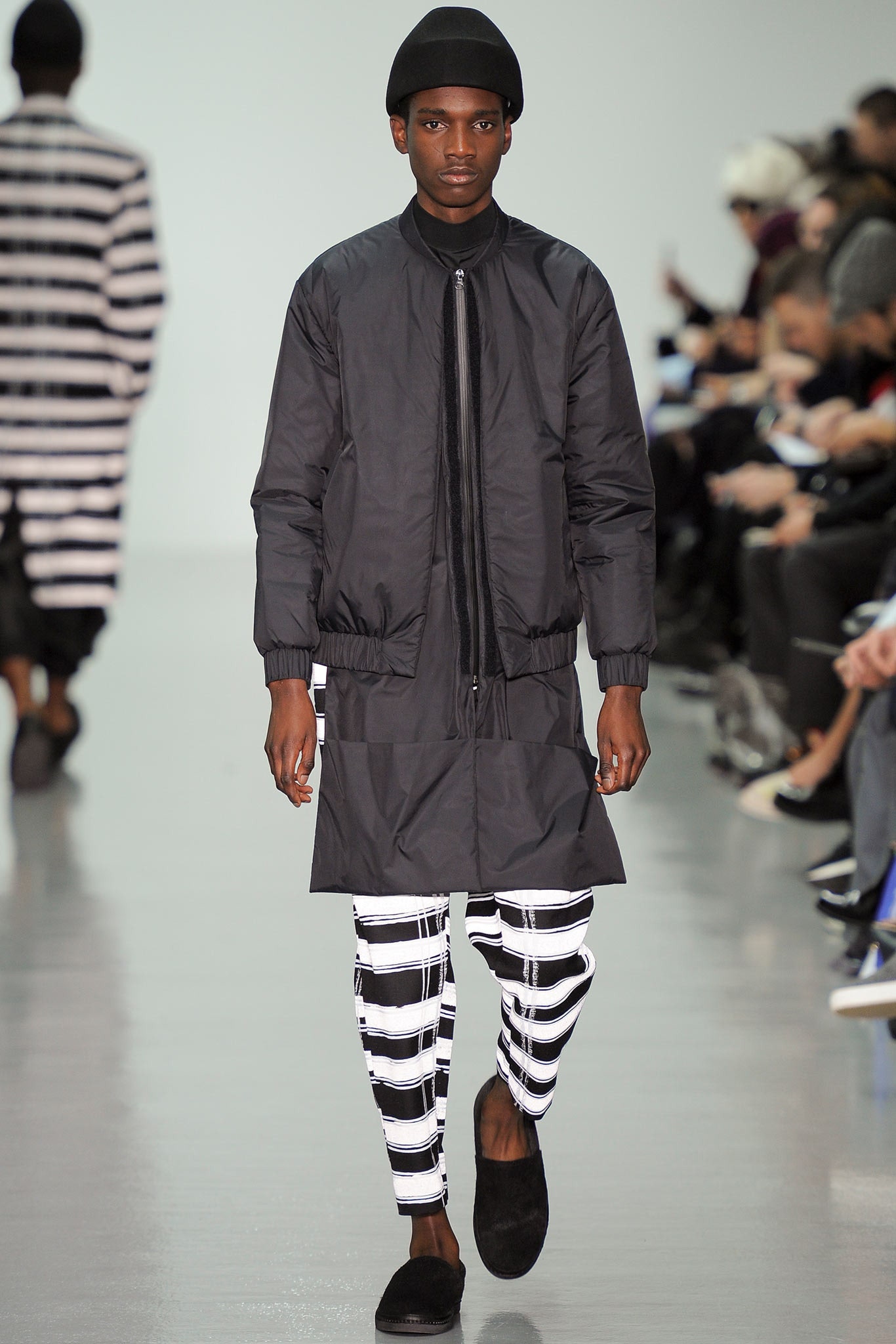 black vinyl relaxed jacket with striped pants