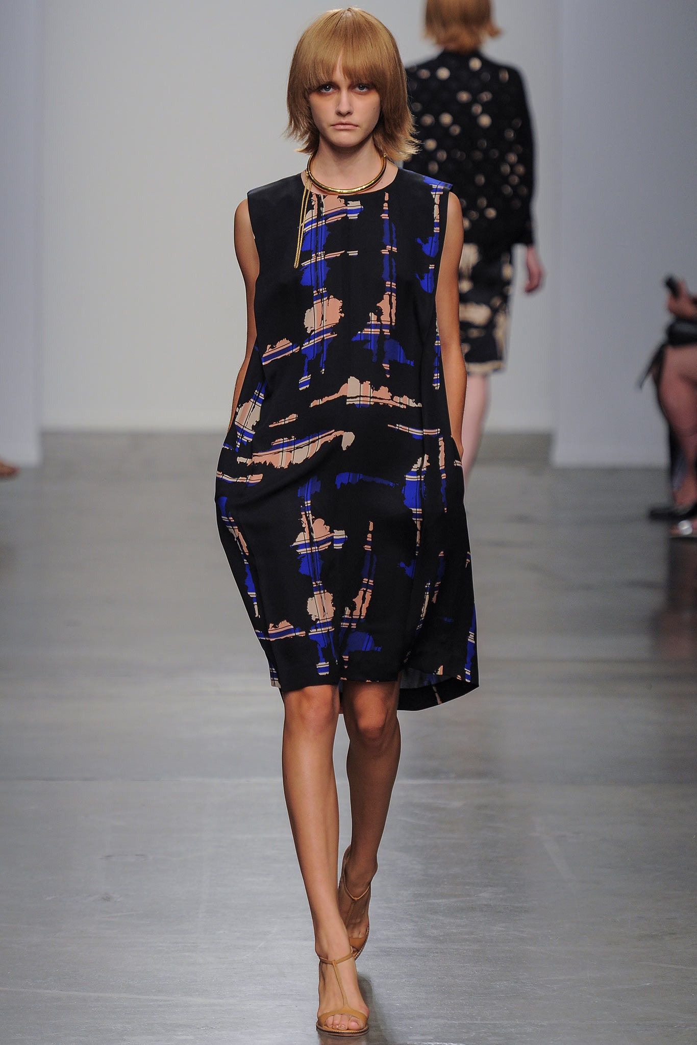 A relaxed black and blue printed dress with a high neckline and sleeveless design.