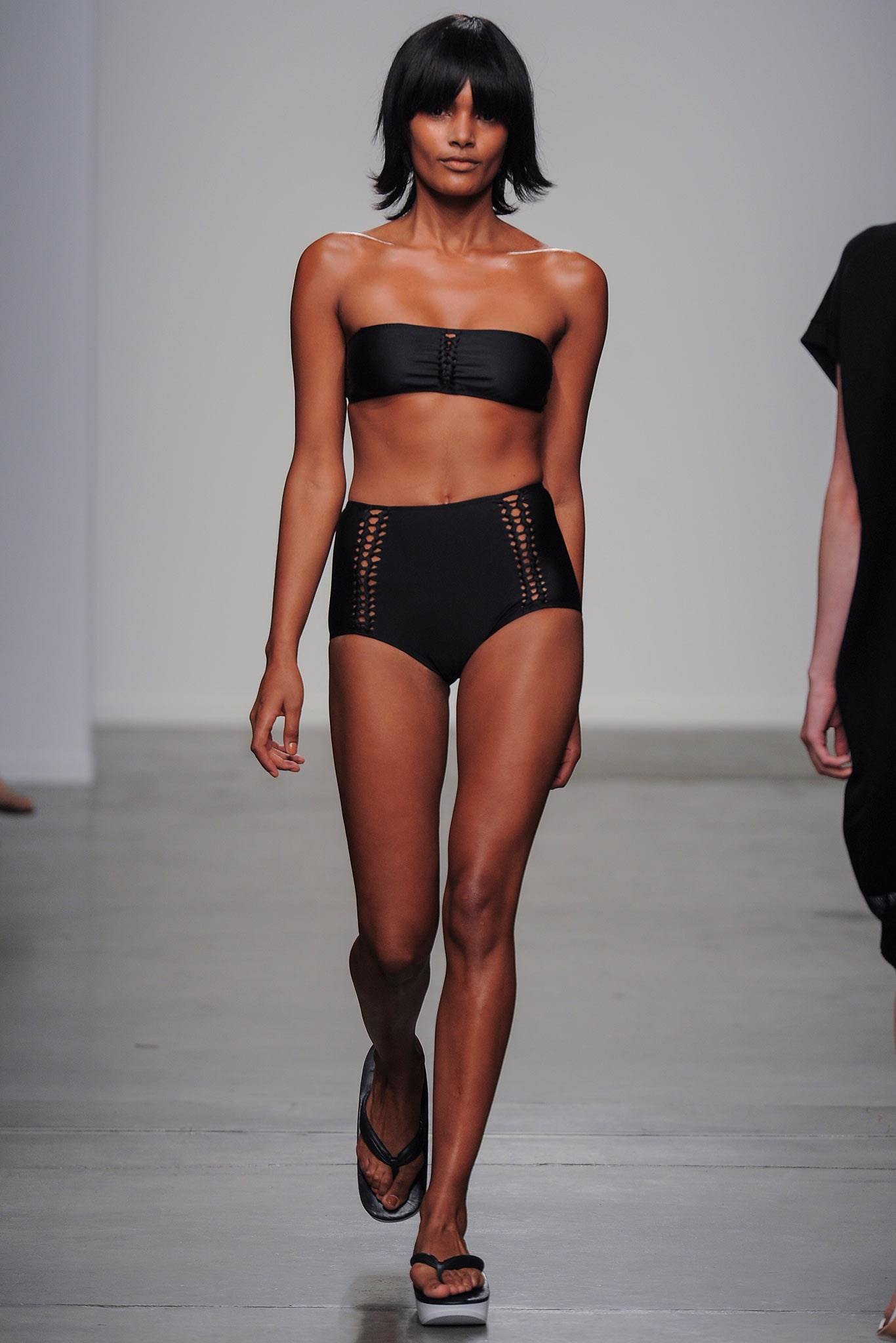 A fitted black strapless bikini featuring a high-waisted bottom.
