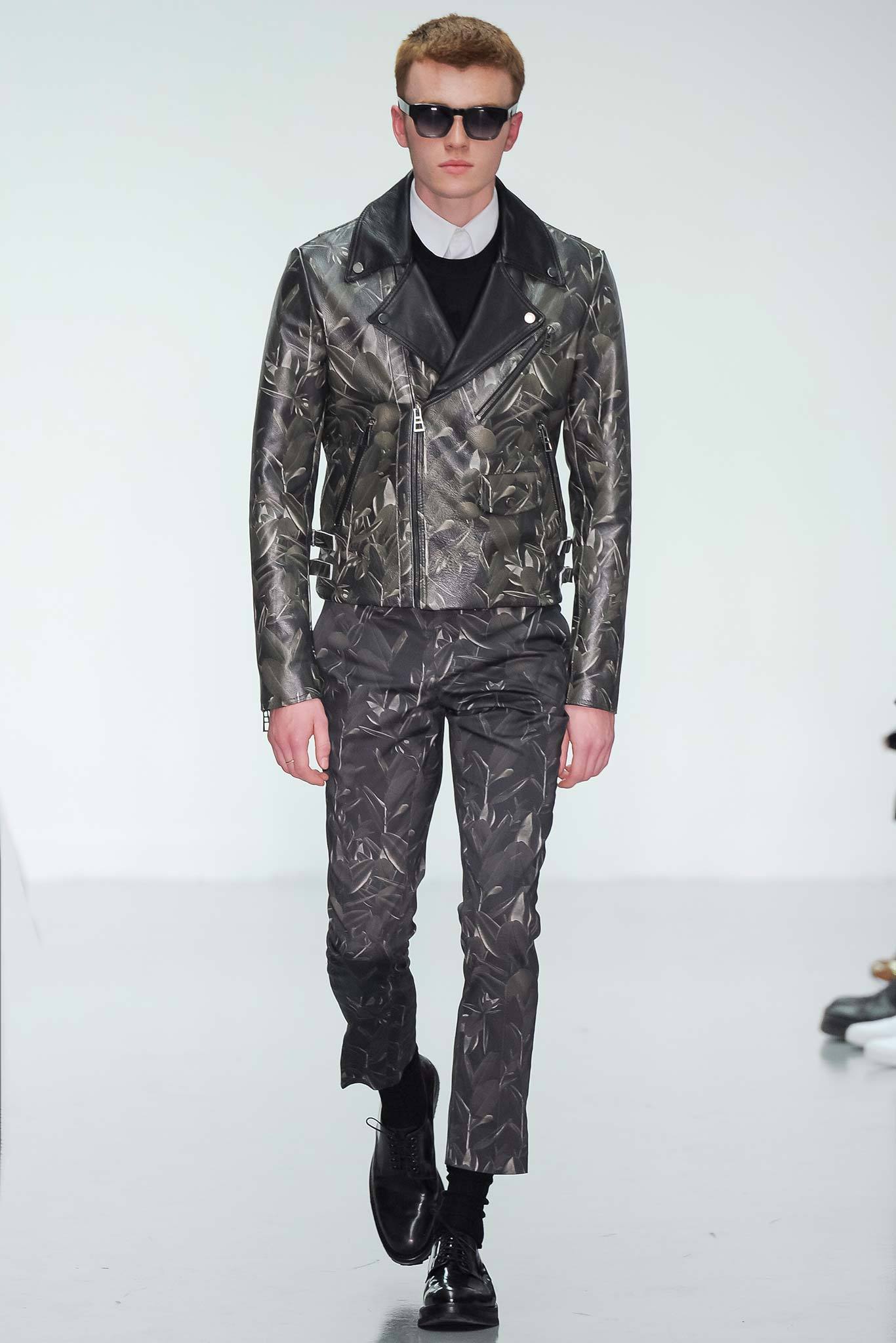 fitted black leather jacket and slim pants