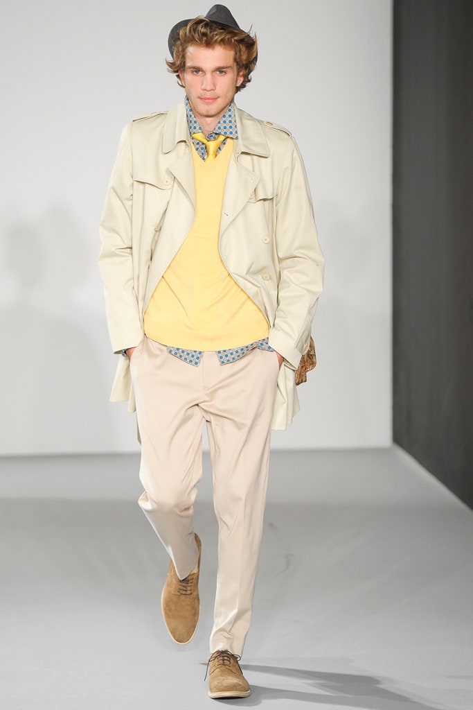 beige trench coat with yellow sweater