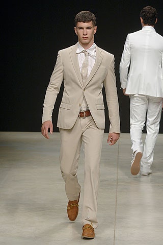 beige tailored suit with brown shoes