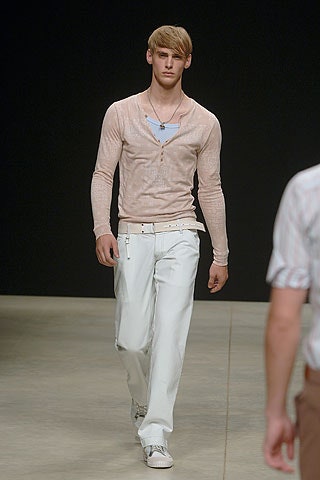 fitted pink cardigan with relaxed white pants