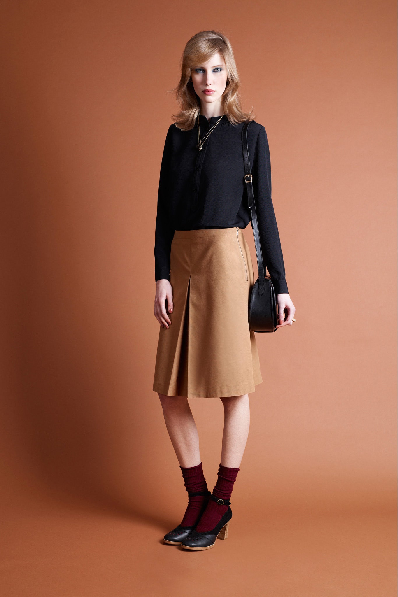 black silk blouse beige leather skirt
