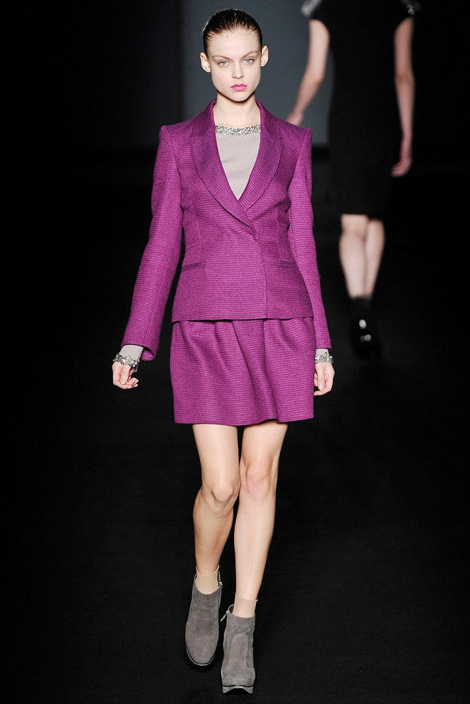 purple tailored blazer and pleated skirt