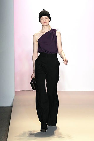 fitted purple asymmetric top with relaxed black pants