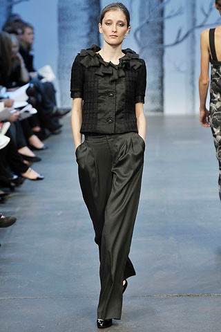 black ruffled blouse and wide-leg pants