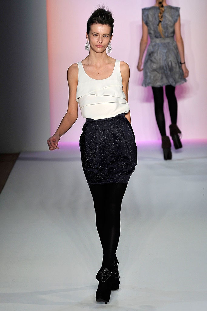 white fitted top with black mini skirt