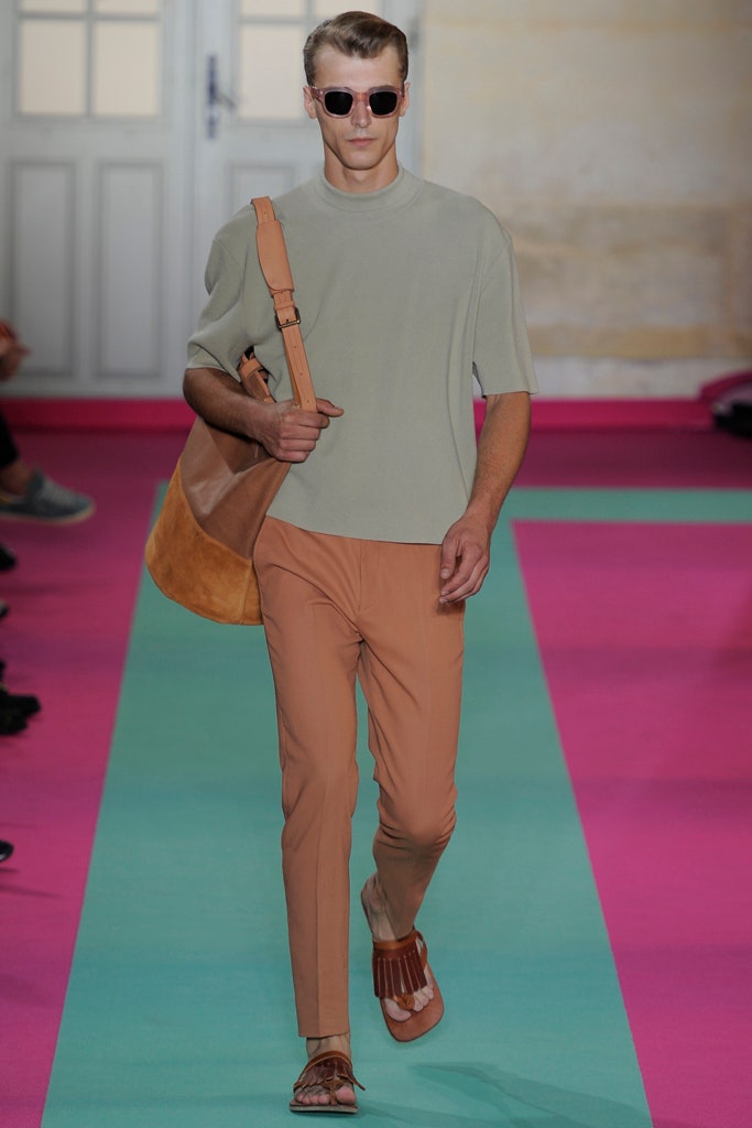 green relaxed top with orange pants