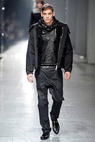 black leather fitted jacket and relaxed pants