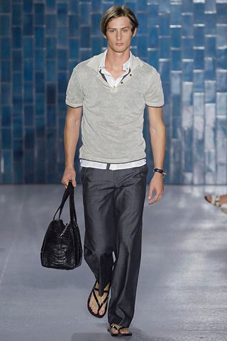 gray short-sleeve top with black pants