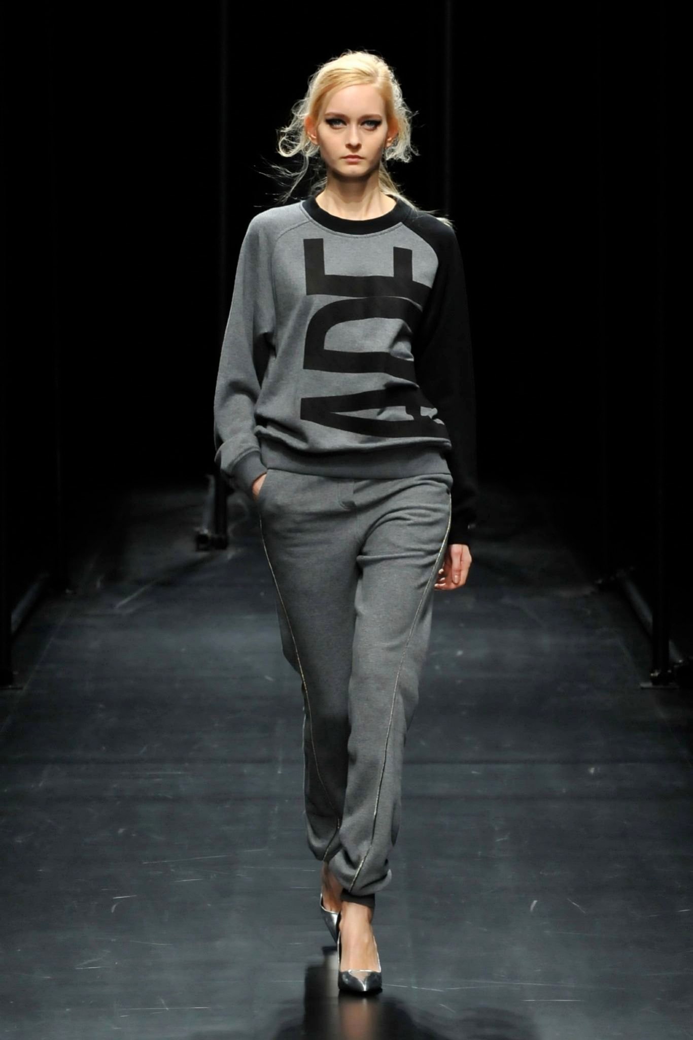 A relaxed gray printed sweater paired with matching pants for a casual look.