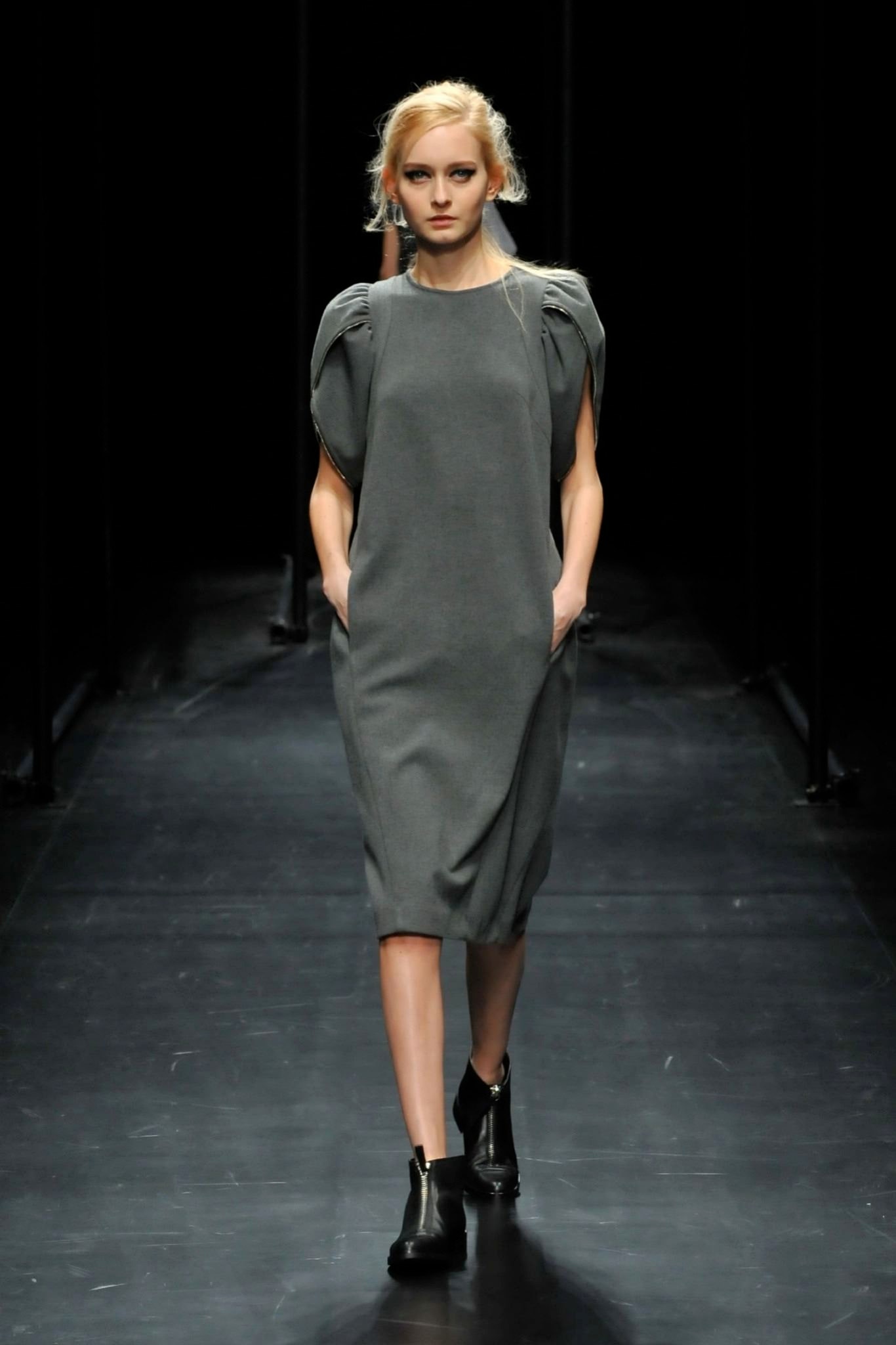A relaxed gray dress with short sleeves and an asymmetric design.